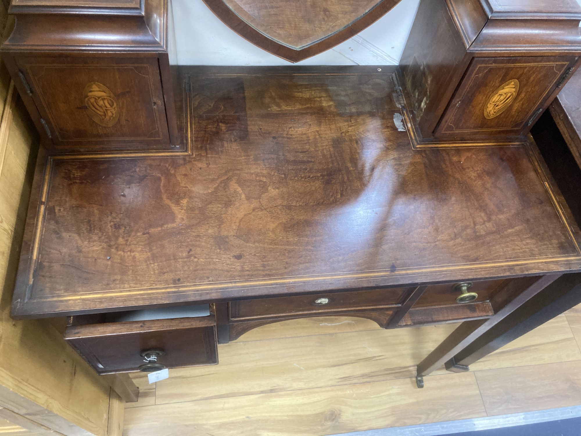 A George III inlaid mahogany kneehole dressing table, width 92cm, depth 50cm, height 140cm